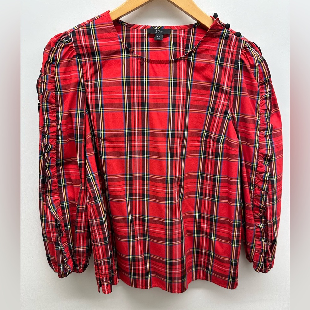 Plaid puffed and ruffled sleeved top.